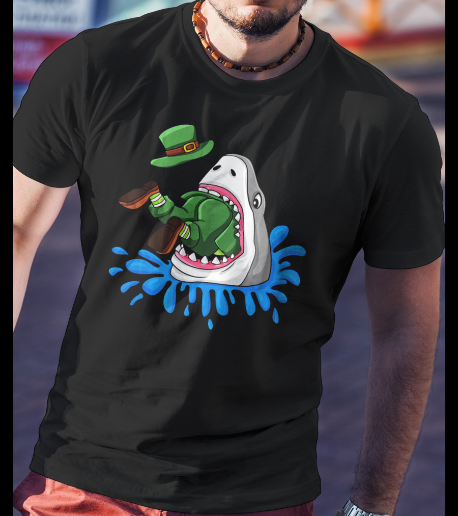 Shark Devours Leprechaun Wearing Green Outfit With Dropped Hat In Water Splash T-Shirt