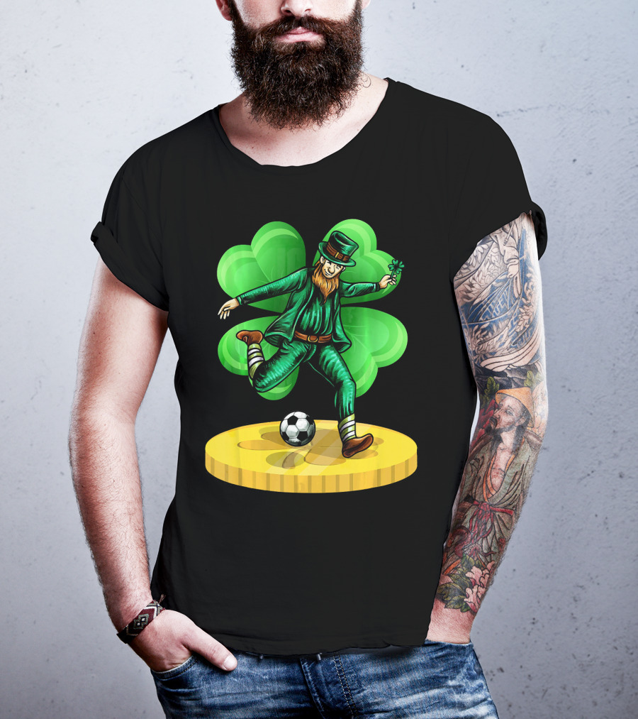 Leprechaun Kicking Soccer Ball On Gold Coin With Shamrock Background T-Shirt