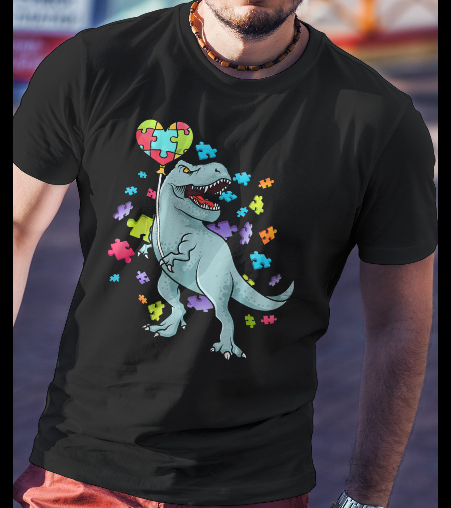 Autism Awareness Dinosaur With Puzzle Heart Balloon And Colorful Puzzle Pieces T-Shirt