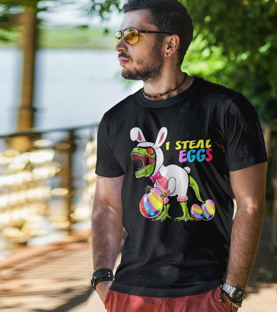 I Steal Easter Eggs Dinosaur Rex Bunny In Costume Holding Colorful Striped Eggs T-Shirt