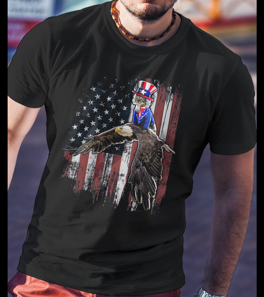 Uncle Sam Costume Cat Riding Bald Eagle On American Flag Background T-Shirt