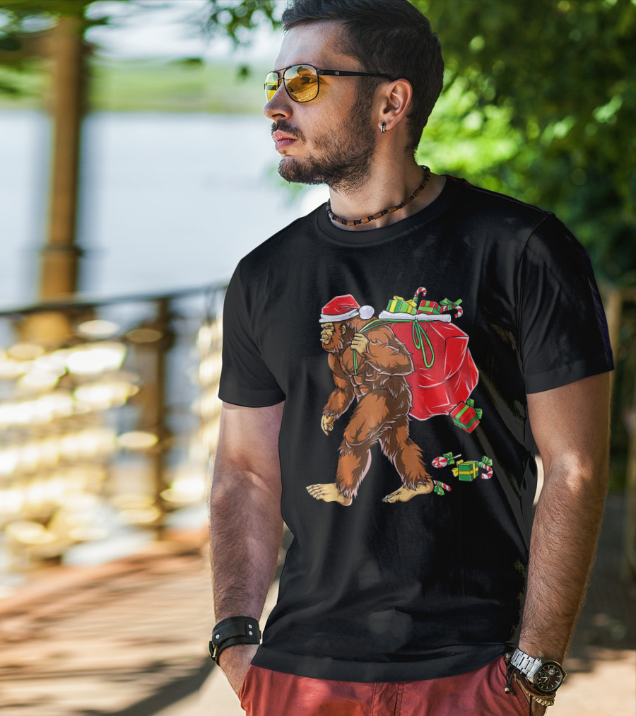 Bigfoot Santa Carrying Gifts With Candy Canes T-Shirt
