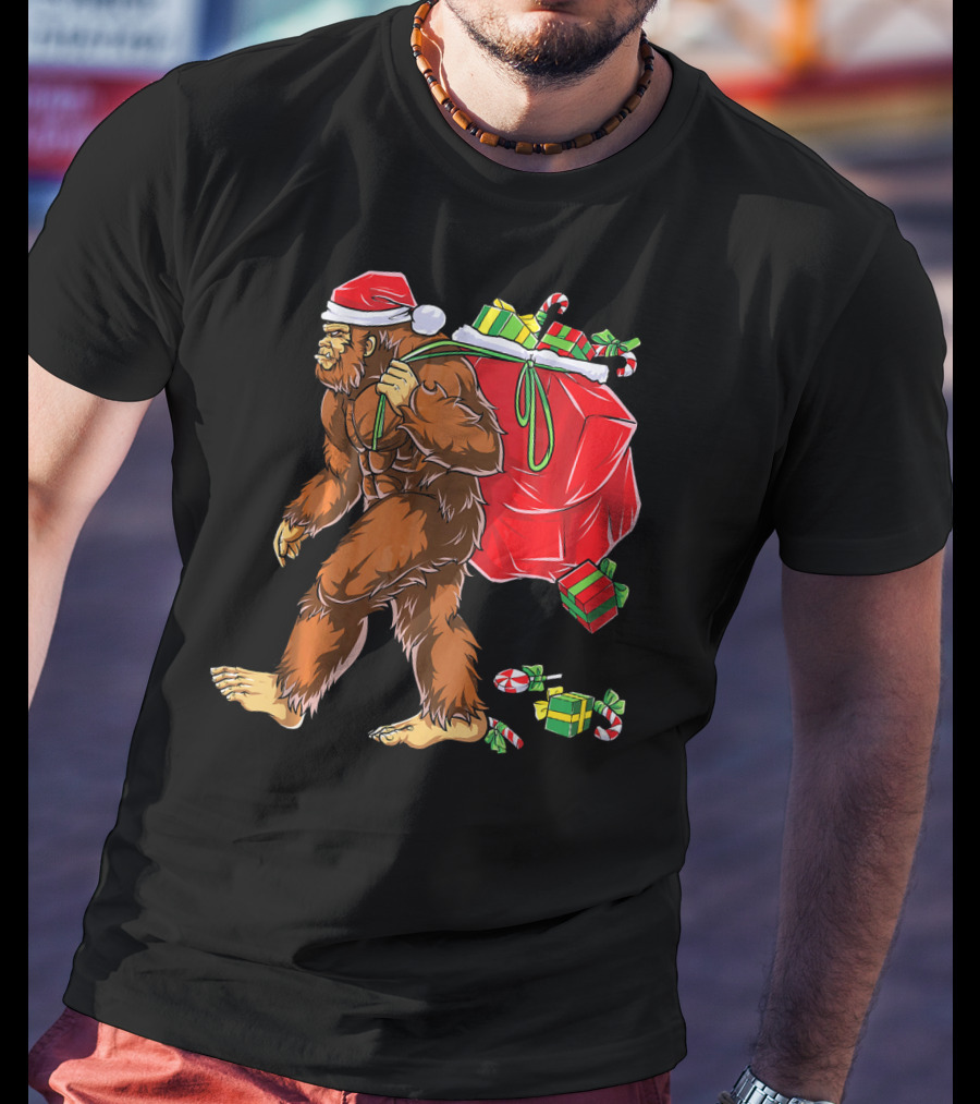 Bigfoot Santa Carrying Gifts With Candy Canes T-Shirt