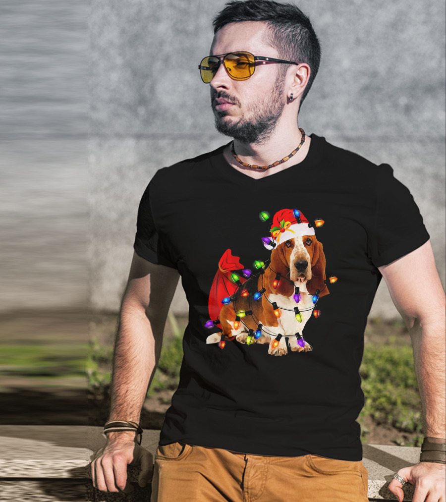 Basset Hound Wrapped In Christmas Lights With Santa Hat And Red Sack T-Shirt