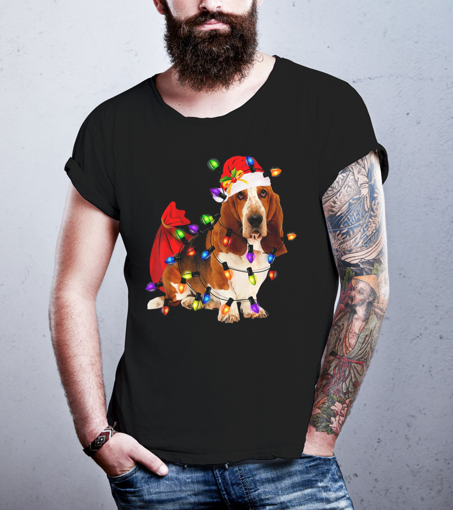Basset Hound Wrapped In Christmas Lights With Santa Hat And Red Sack T-Shirt