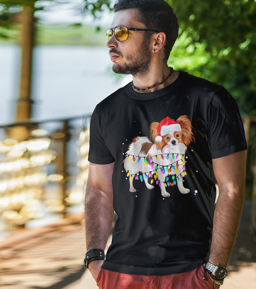 Papillon Dog Wrapped In Colorful Christmas Lights Wearing Santa Hat T-Shirt