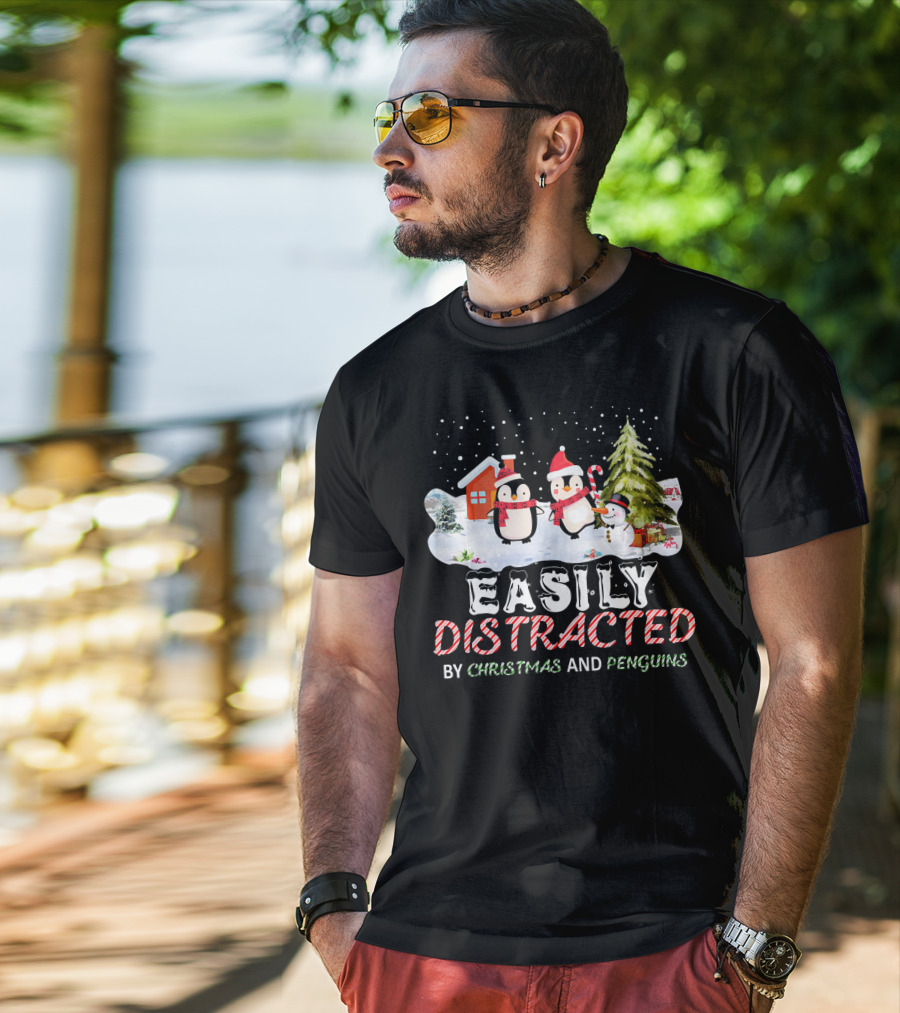 Easily Distracted By Christmas And Penguins In Winter Wonderland With Snowman House And Tree T-Shirt