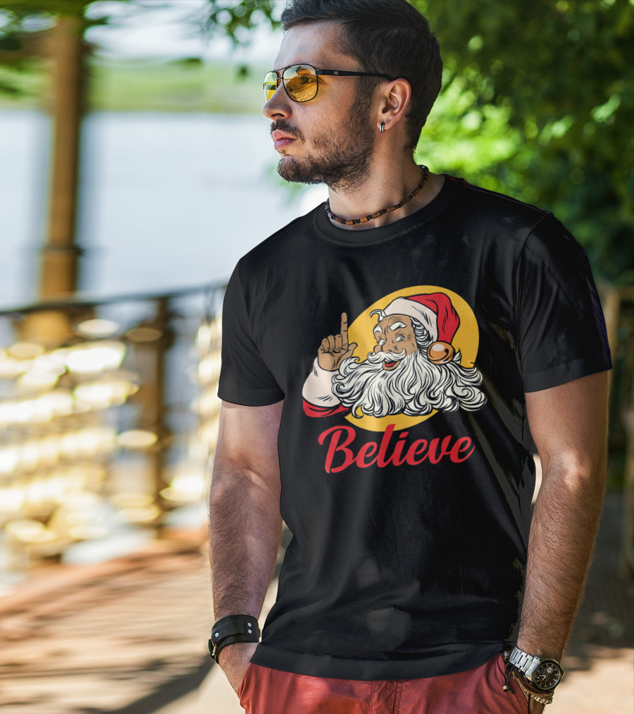 Black Santa Claus With Believe Caption And Yellow Background T-Shirt