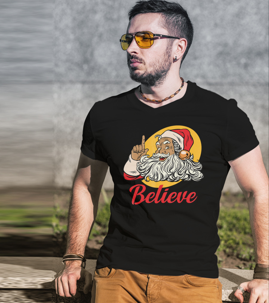 Black Santa Claus With Believe Caption And Yellow Background T-Shirt
