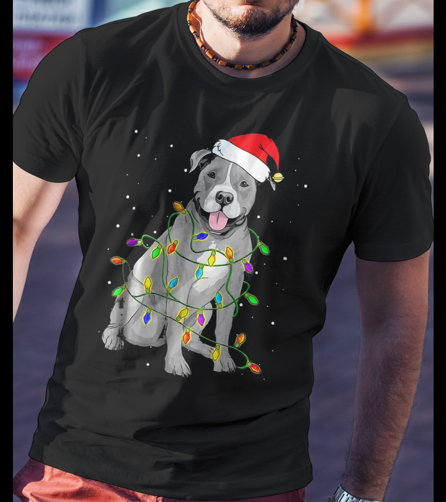 Pitbull In Santa Hat Wrapped In Christmas Lights With Snowy Background T-Shirt