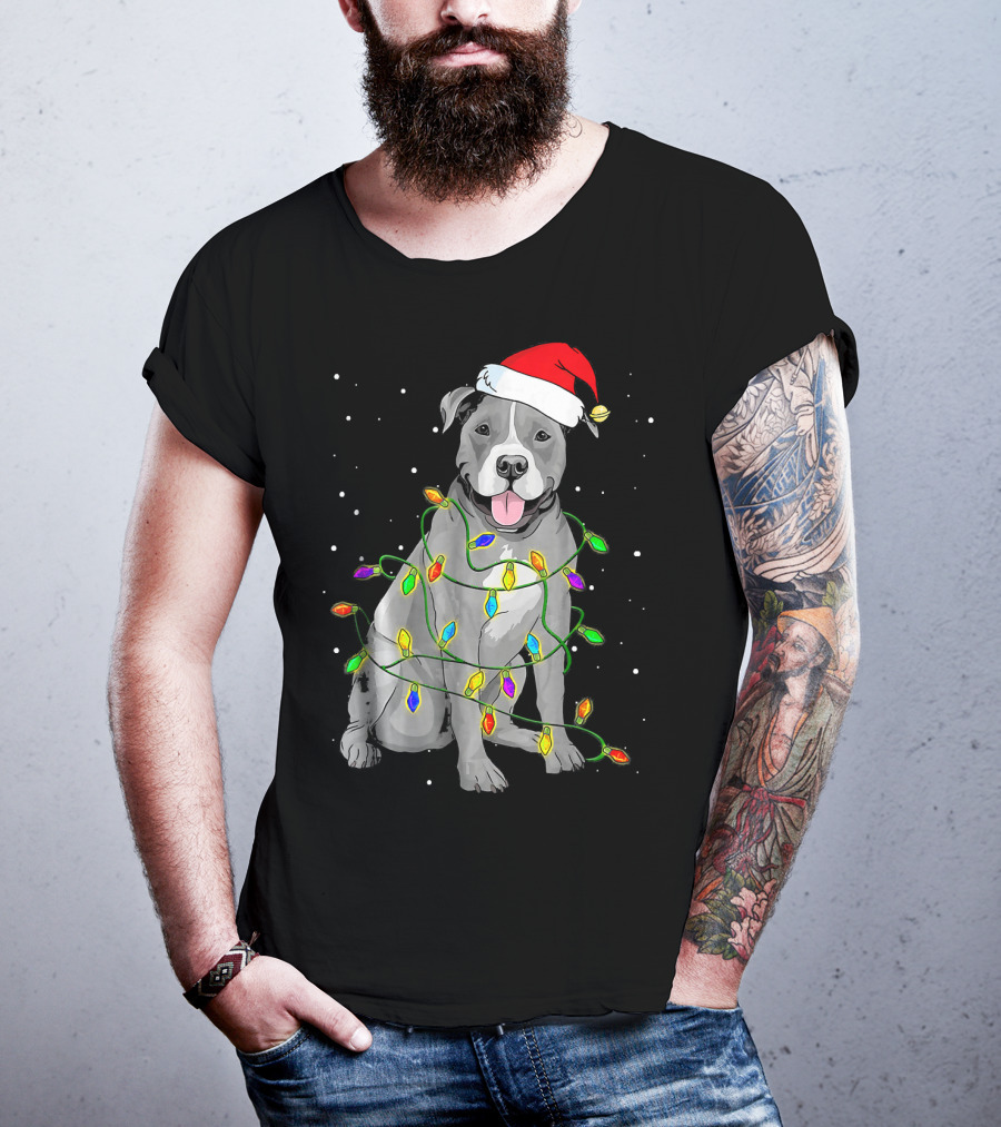 Pitbull In Santa Hat Wrapped In Christmas Lights With Snowy Background T-Shirt