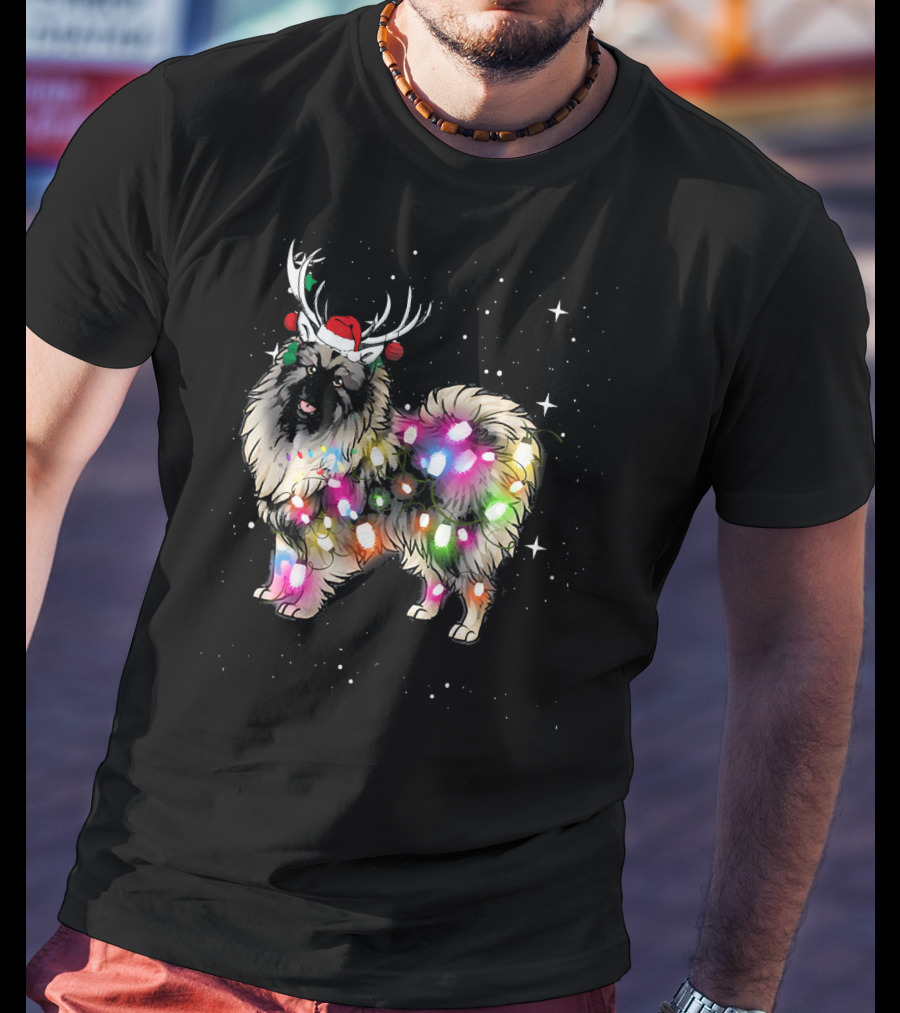 Keeshond Dog Wrapped In Christmas Lights Wearing Red Santa Hat And Antlers T-Shirt