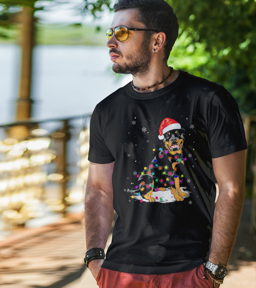 Rottweiler With Santa Hat And Colorful Christmas Lights In Snowy Scene T-Shirt