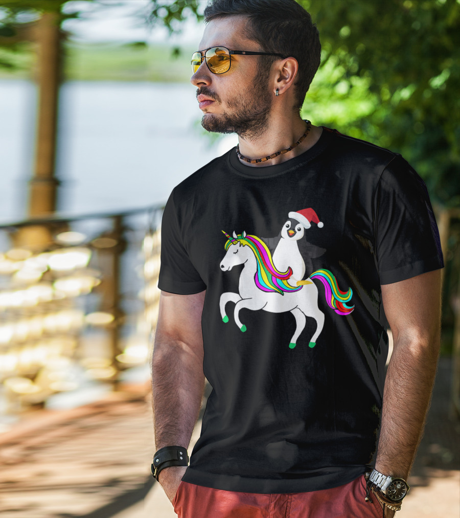 Penguin In Santa Hat Riding A Rainbow Unicorn T-Shirt