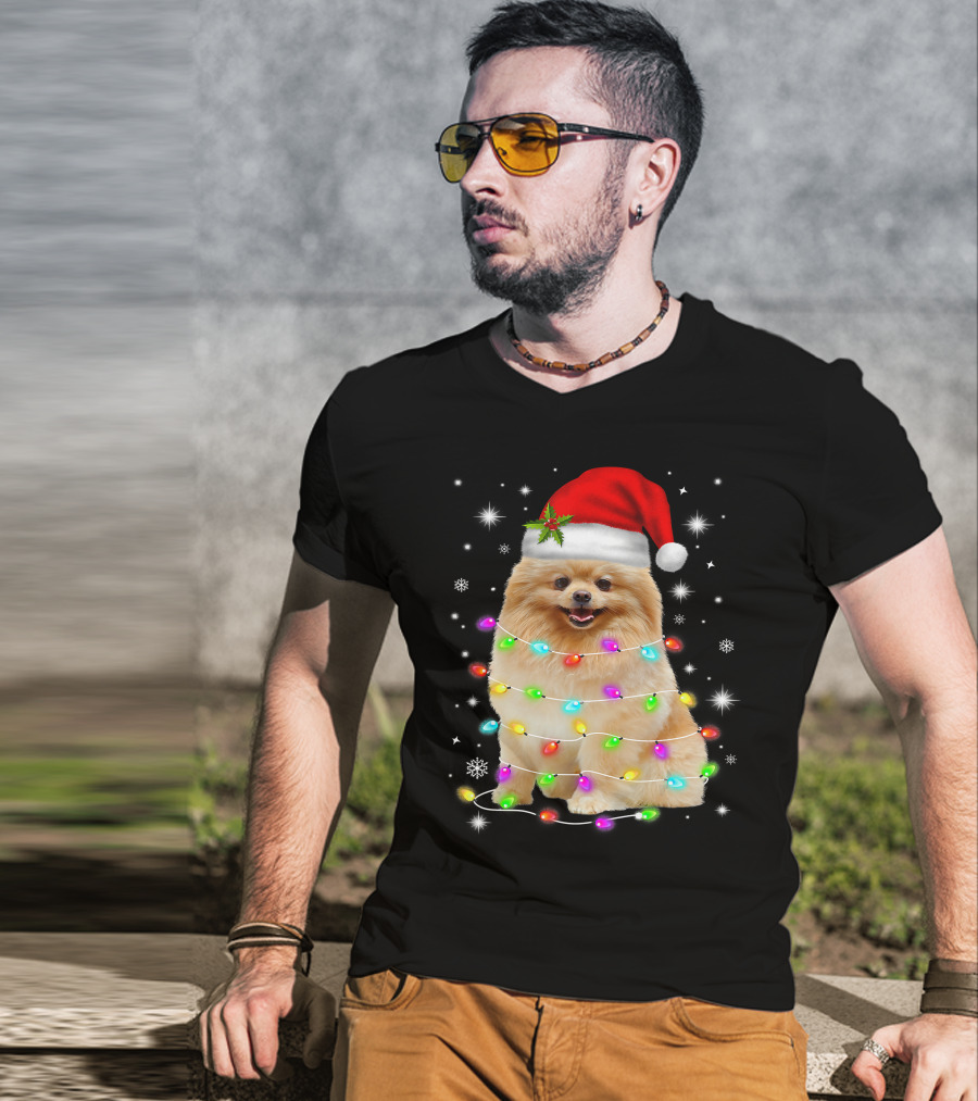 Pomeranian Pup Wrapped In Christmas Lights With Santa Hat And Festive Glow T-Shirt