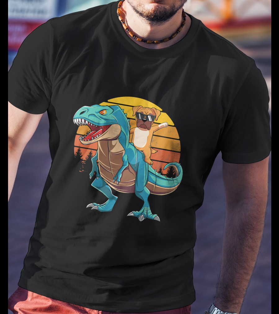 Boxer Dog With Sunglasses Riding Blue T-Rex Against Sunset Background T-Shirt